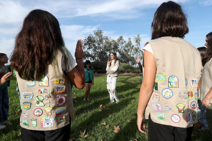 Newport Beach Girl Scouts from troops 7483 and 5381, meet complete with their vests adorned with their favorite patches during semi-monthly meeting at Newport Ridge Community Park. Girl Scouts of Orange County has received $2.8M contribution and plan to expand access to its programs for a broader spectrum of girls in OC.