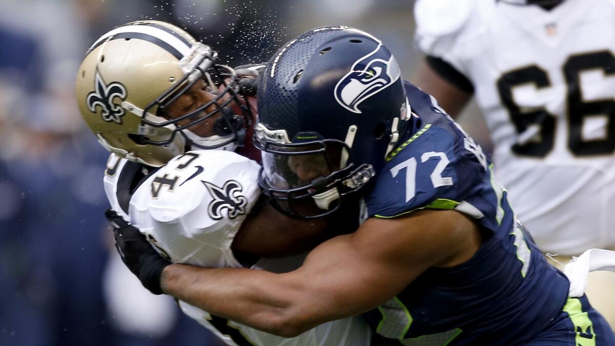 Michael Bennett of the Seattle Seahawks, right, in a 2014 game.