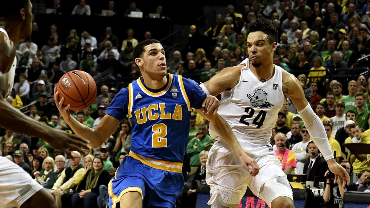 UCLA guard Lonzo Ball drives past Oregon guard Dillon Brooks (24) during their Pac-12 game on Dec. 28 in Eugene.
