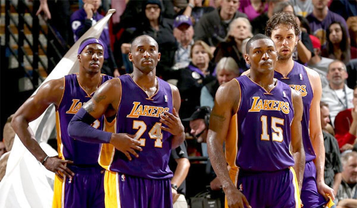 Dwight Howard, Kobe Bryant, Metta World Peace, and Pau Gasol stand together during a time out in the Lakers' 113-97 loss to the Sacramento Kings.