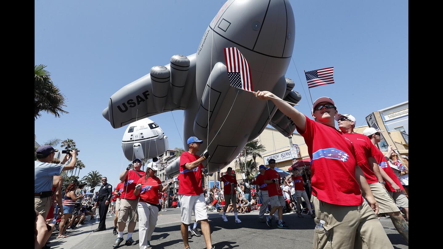 Boeing representatives participate in the annual Huntington Beach 4th of July Parade on Wednesday.