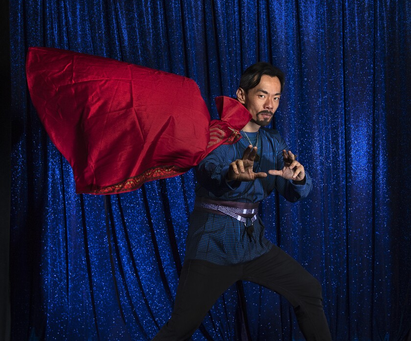 Aidan Park strikes a superhero pose with his flowing cape