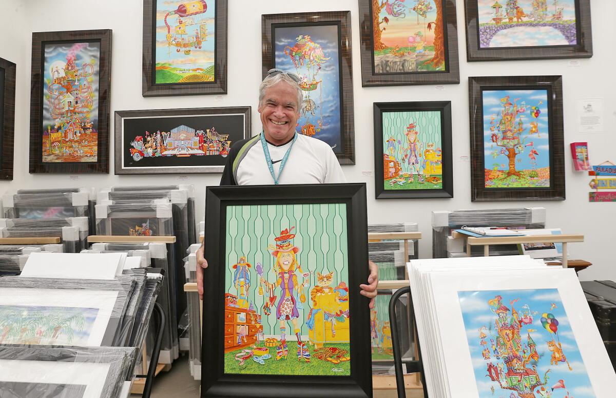 Acrylic artist Dale Patterson shows one of his favorite whimsical character pieces at Art-A-Fair on June 30.