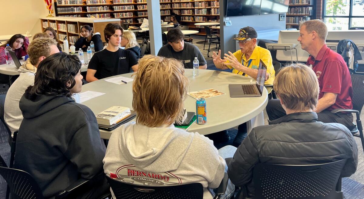 Billy Hall and Dwight Hanson share veteran stories with students.