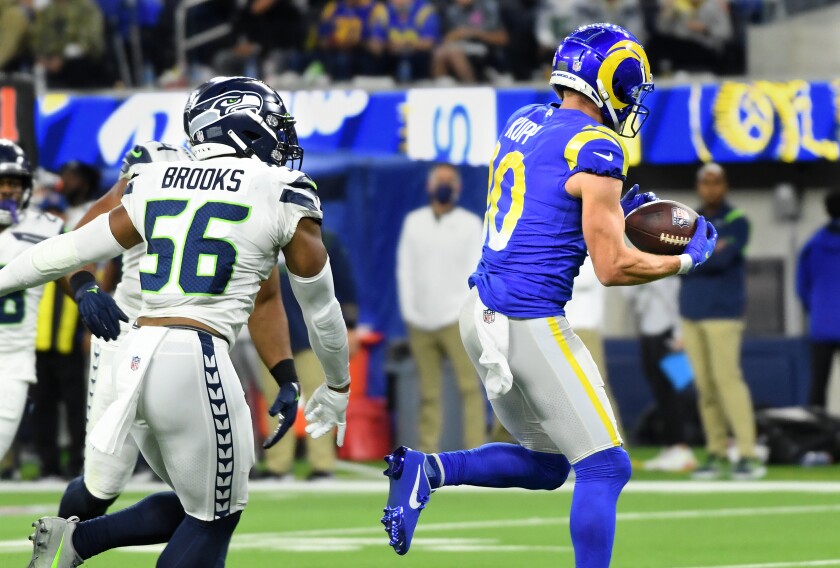 NFL roundtable: Why Rams, Chargers must win last three games - Los Angeles Times 3 Rams receiver Cooper Kupp runs past Seahawks linebacker Jordyn Brooks for the touchdown reception.