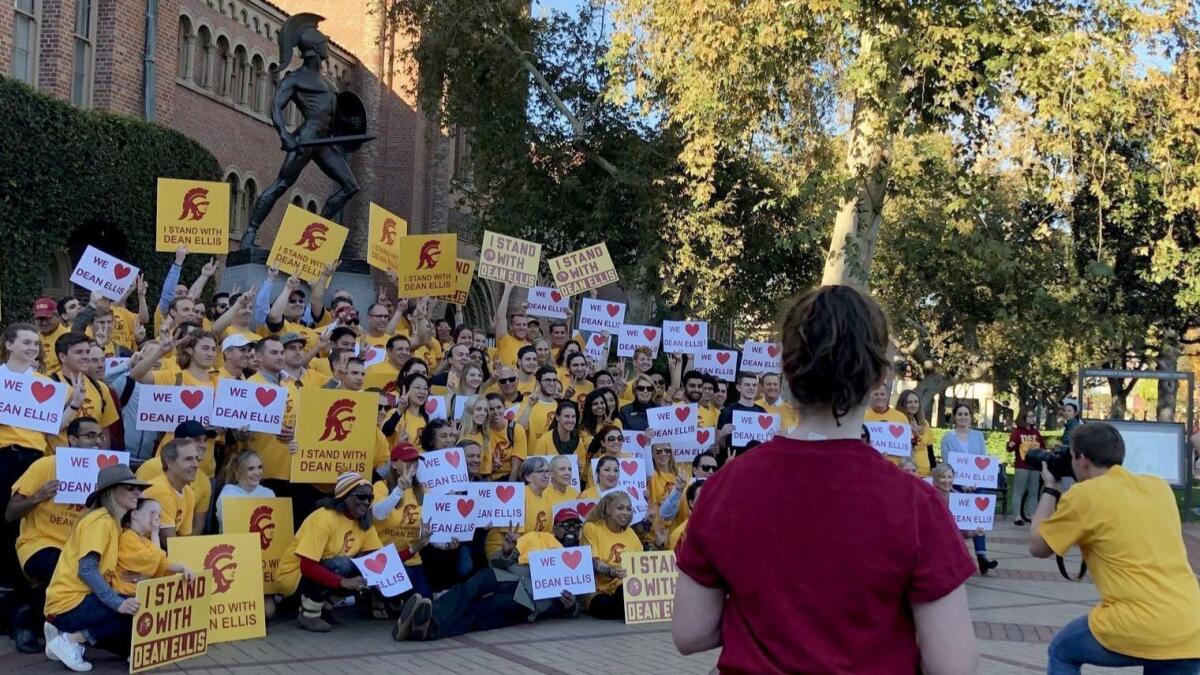 About 150 people gathered Friday to protest the ouster of USC's business school dean, James G. Ellis.