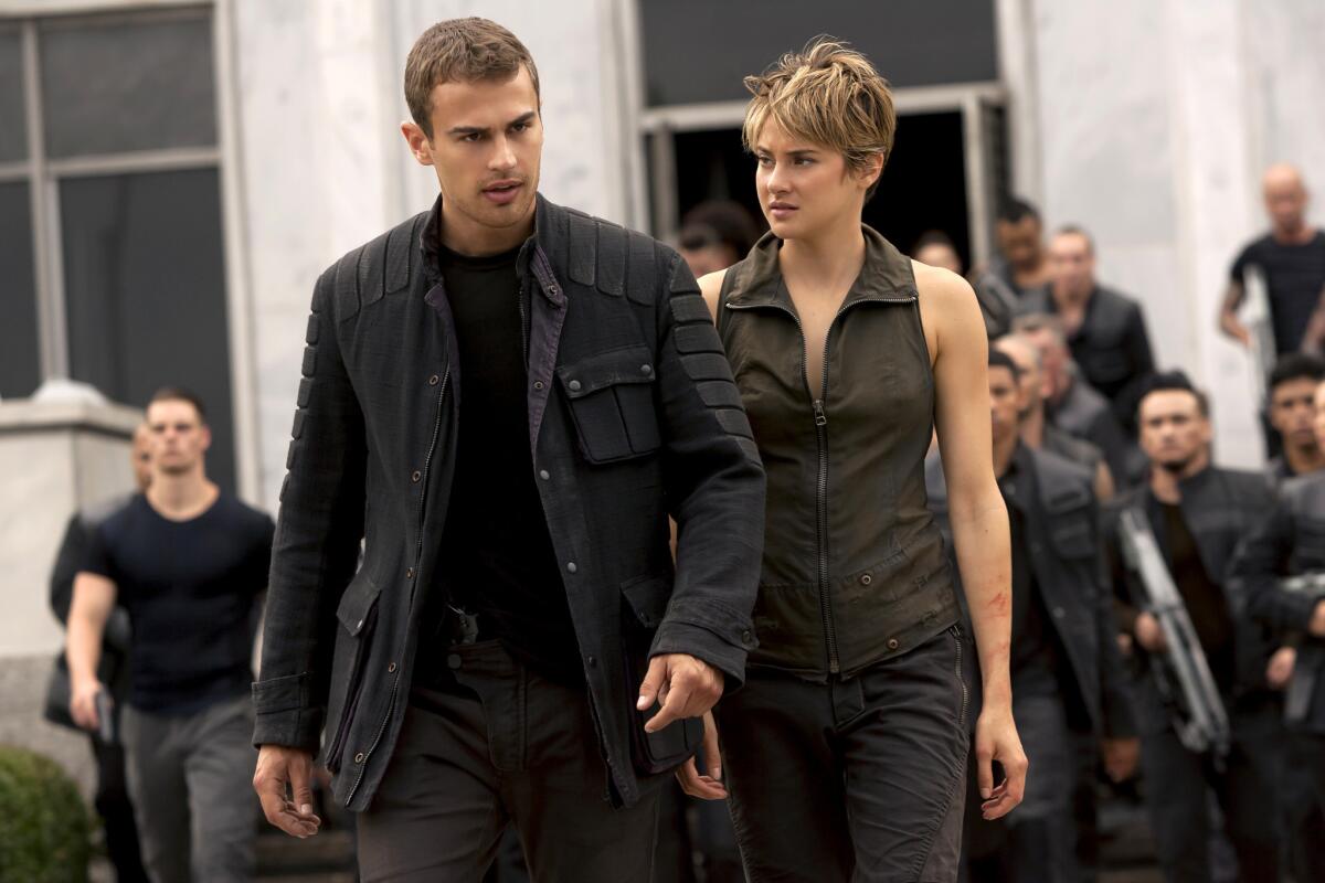 Theo James, left, and Shailene Woodley appear in a scene from "Insurgent," the sequel to last year's "Divergent."