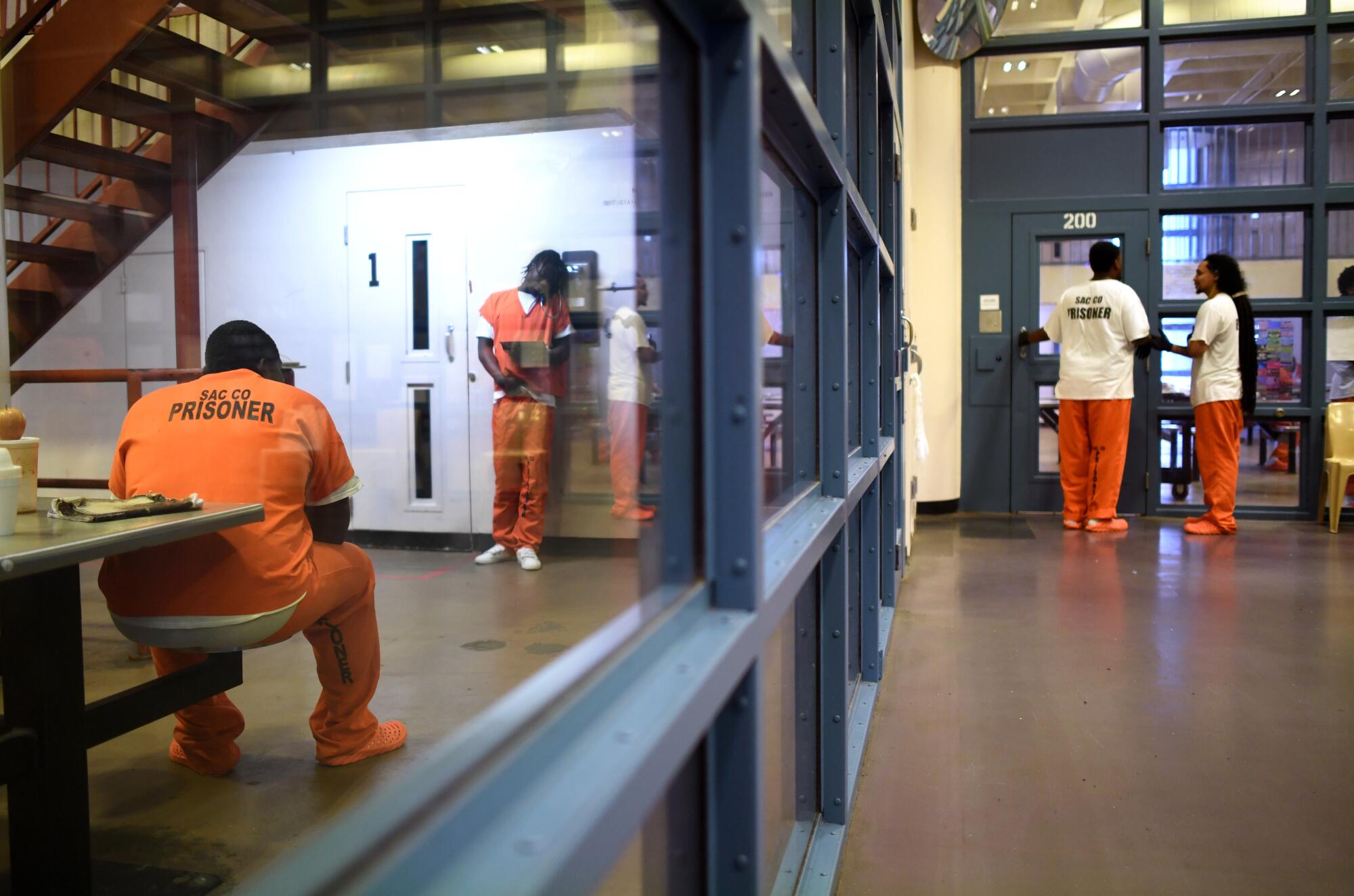 General population inmates hang out in their housing pod in Sacramento's main Jail.