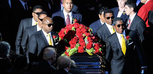 The Jackson Brothers (L-R) Randy, Marlon, Jackie, Jermaine and Tito accompany the casket into the Michael Jackson public memorial service held at Staples Center on July 7, 2009, in Los Angeles.