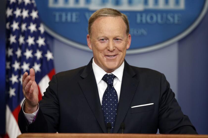 FILE - In this Tuesday, June 20, 2017, file photo, then-White House press secretary Sean Spicer smiles as he answers a question during a briefing at the White House, in Washington. Spicer, who has a memoir coming out July 24, will make appearances in the summer and fall. (AP Photo/Alex Brandon, File)