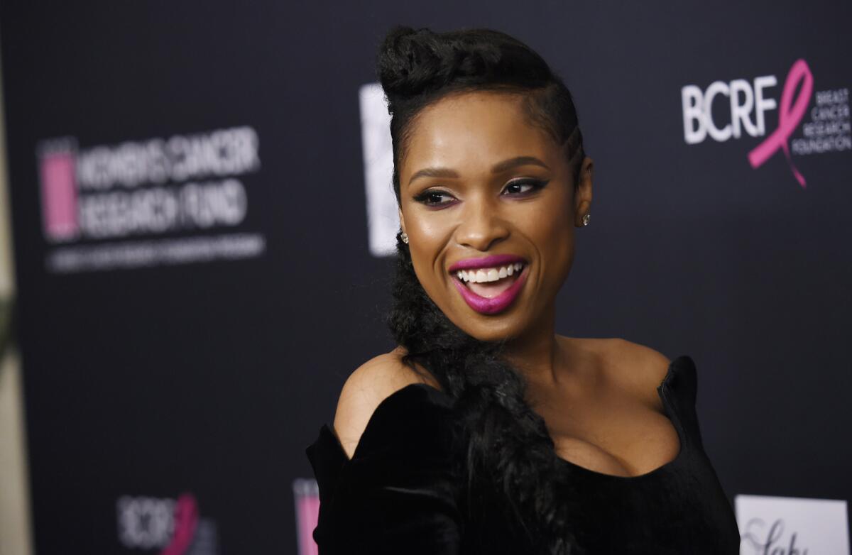 Honoree Jennifer Hudson, recipient of the Nat King Cole Award, arrives at the Women's Cancer Research Fund's An Unforgettable Evening gala on Tuesday at the Beverly Wilshire Hotel in Beverly Hills.