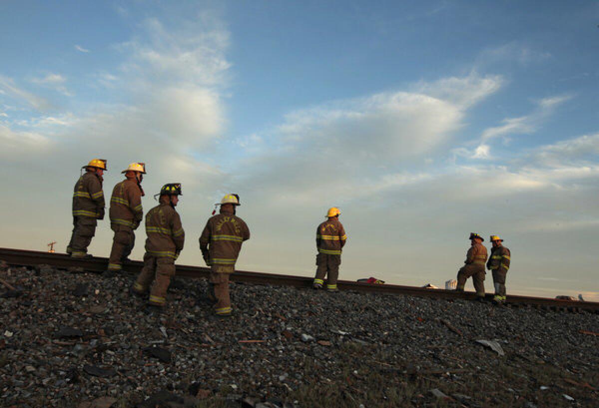 Valley Mills Fire Department personnel gather near the fertilizer plant that exploded in West, Texas.
