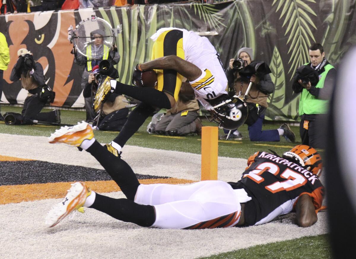 Steelers receiver Martavis Bryant makes a 10-yard touchdown reception against Bengals cornerback Dre Kirkpatrick during the second half of an NFL wild-card playoff game on Jan. 9.