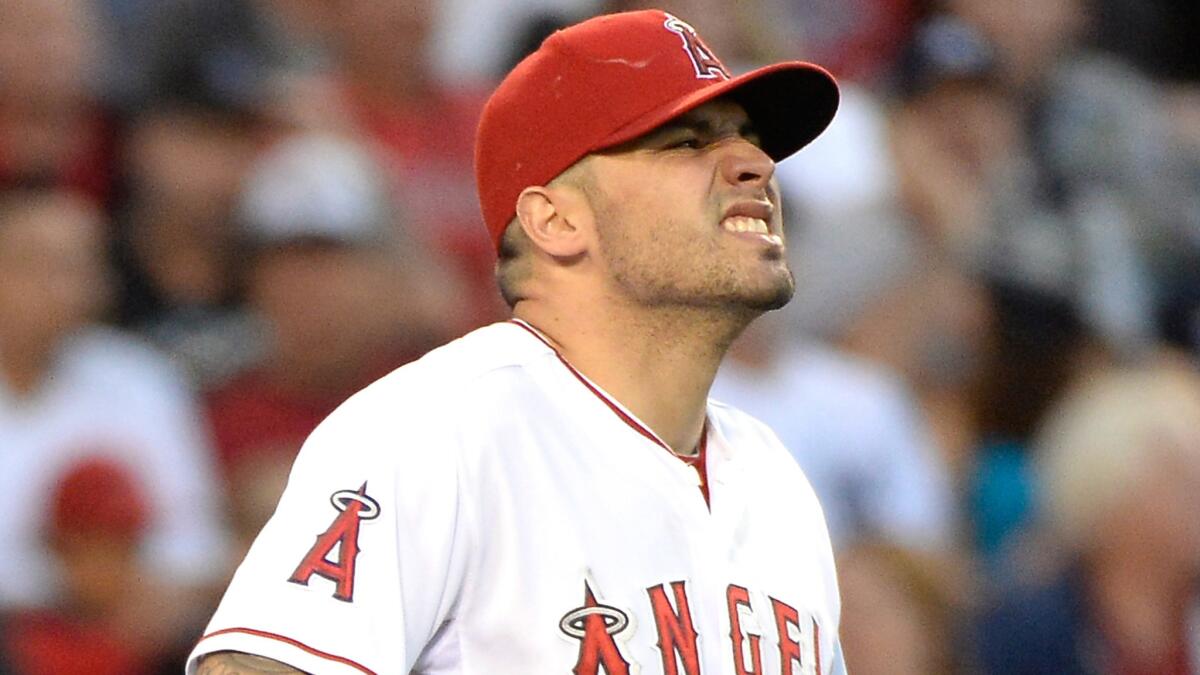 Angels pitcher Hector Santiago reacts after making a wild pitch during a game against the New York Yankees on May 7. The Angels moved Santiago to triple-A Salt Lake on Wednesday.