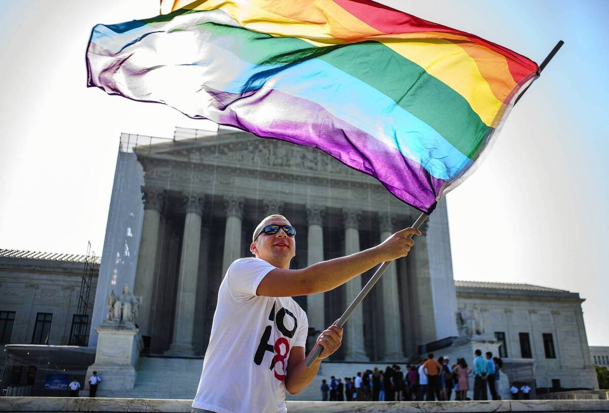 Demonstrators gathered in front of the U.S. Supreme Court before the justices on Wednesday made two landmark rulings on same-sex marriage.