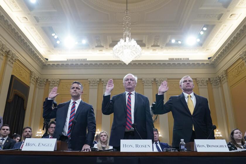 Steven Engel, former Assistant Attorney General for the Office of Legal Counsel, from left, Jeffrey Rosen, former acting Attorney General, and Richard Donoghue, former acting Deputy Attorney General, are sworn in to testifyas the House select committee investigating the Jan. 6 attack on the U.S. Capitol continues to reveal its findings of a year-long investigation, at the Capitol in Washington, Thursday, June 23, 2022.(AP Photo/Jacquelyn Martin)