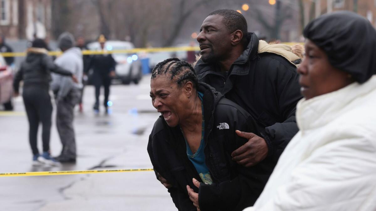 Georgia Jackson, 72, learns that her two grandsons, Raheem and Dillon Jackson, were found fatally shot in the South Shore neighborhood in Chicago on Thursday, March 30, 2017.