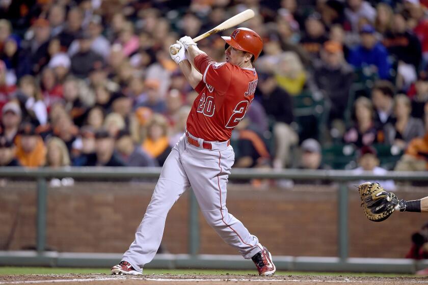 Angels outfielder Matt Joyce hits and RBI single to score third baseman David Freese during a game against the San Francisco Giants on May 1.