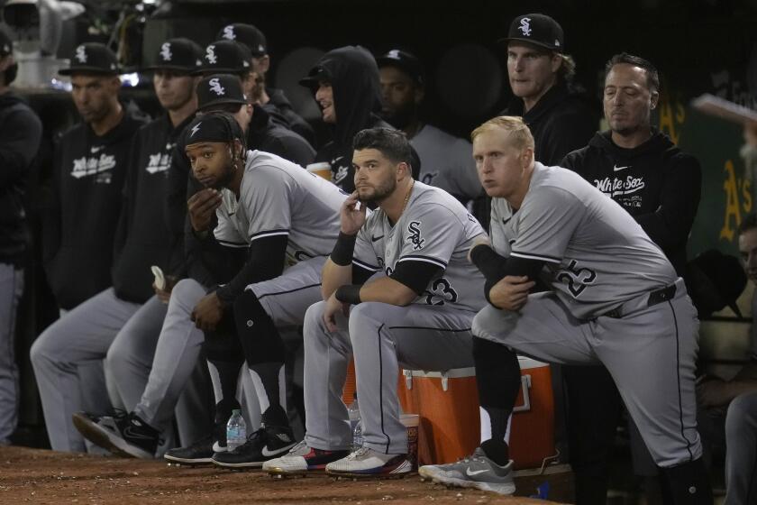 Chicago White Sox players react from the dugout during the eighth inning of a baseball game against the Oakland Athletics in Oakland, Calif., Monday, Aug. 5, 2024. (AP Photo/Jeff Chiu)