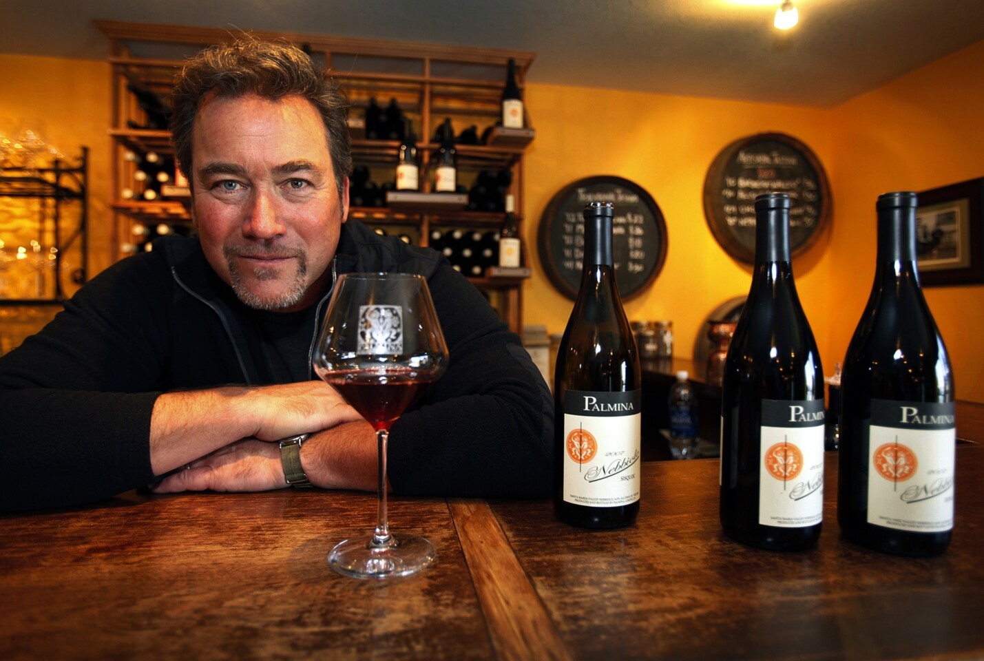 Steve Clifton, winemaker and owner of Palmina Vineyards, in his Lompoc tasting room with his 2007 Nebbiolo wines. He produces a full range of wines crafted from Italian varietals grown in Santa Barbara County.