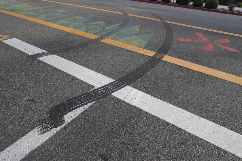 Tire burn marks can be seen where a fatal collision occurred Sunday evening, where a 12-year-old bicyclist collided with a moving truck operated by an impaired driver at the crosswalk at Junipero and Arlington Drives in Costa Mesa. Two were arrested and police are investigating.