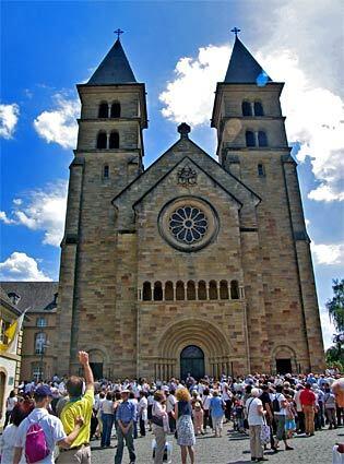 Luxembourg In Echternach in eastern Luxembourg, a country of nearly half a million people, tourists gather in front of the Basilica of St. Willibrord, an imposing, Gothic structure.