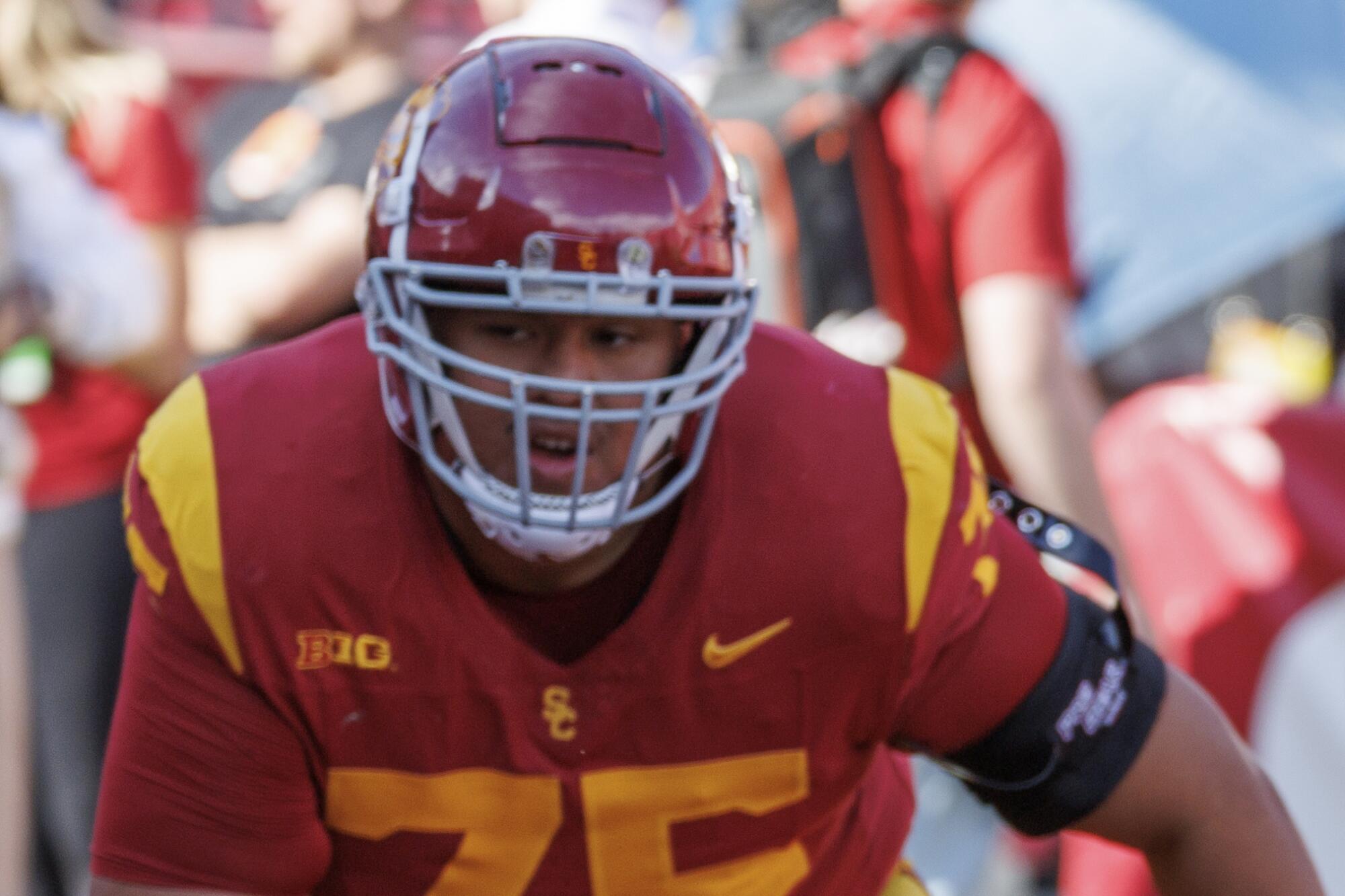 USC Trojans offensive lineman Amos Talalele warms up before the game against Notre Dame.