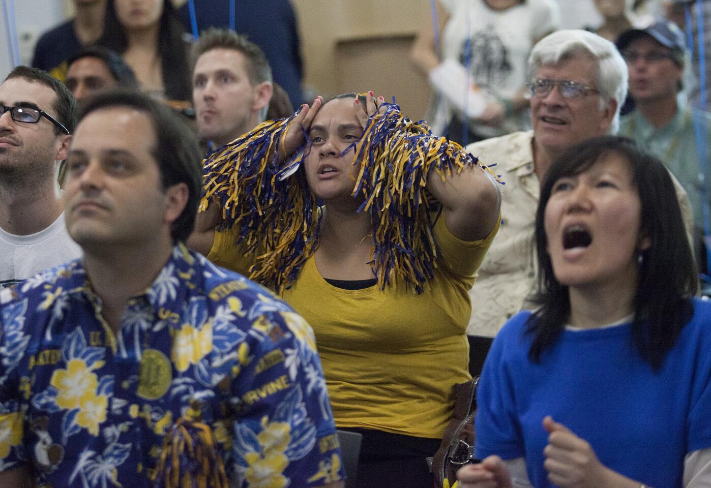 UC Irvine junior Dulce Corum, center, reacts to a play as the Anteaters take on the Louisville Cardinals in a mens' basketball NCAA tournament during a game-viewing party for fans at UC Irvine Newkirk Alumni Center on Friday. UC Irvine fell to Lousiville 57-55. (Kevin Chang/ Daily Pilot)