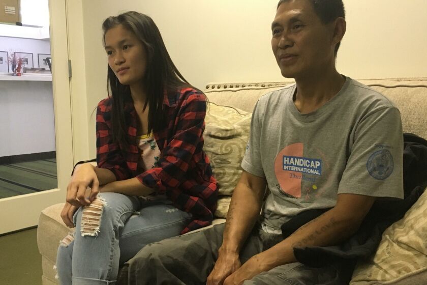 Yawlay Htoo, of Burma, and his daughter Kot Loe discuss a new report detailing refugee experiences.