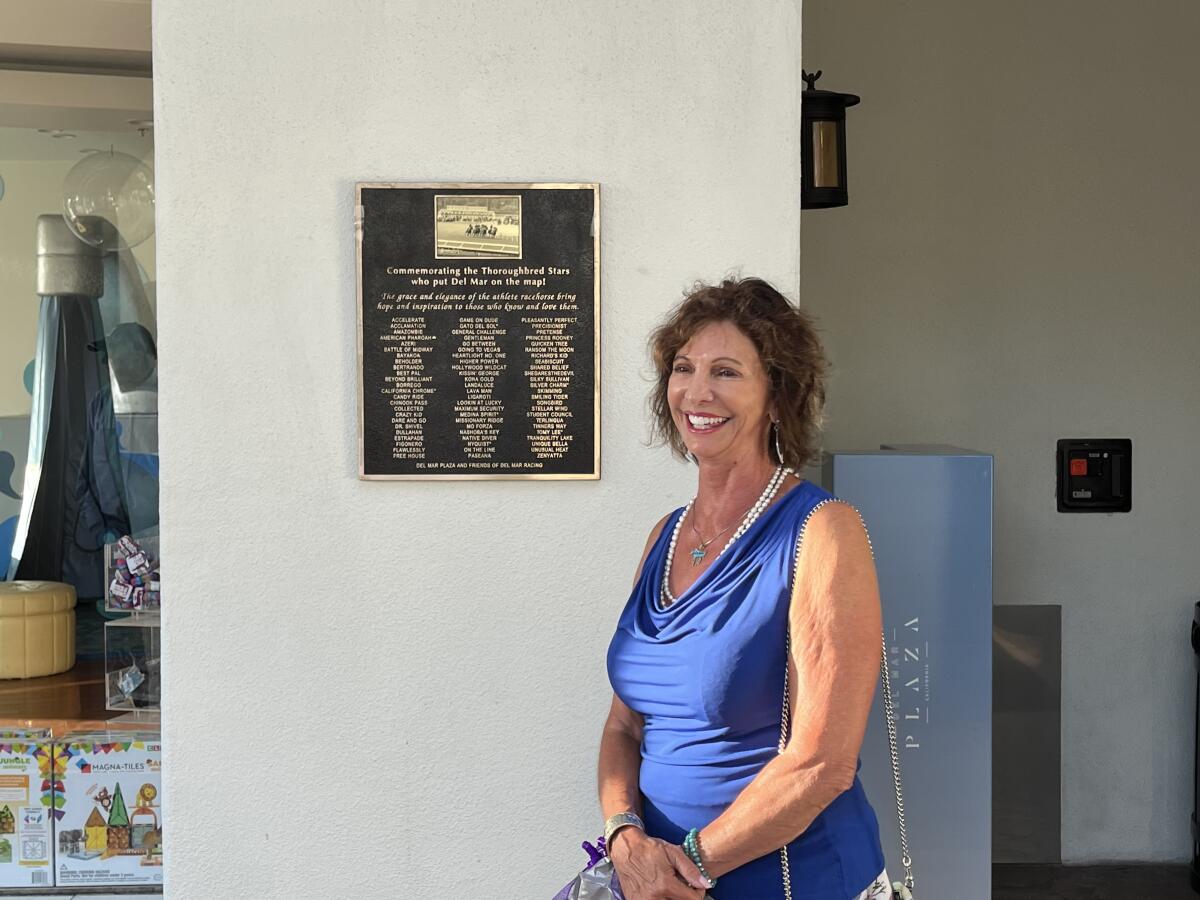 Marla Zanelli unveiled the plaque during a ceremony at Del Mar Plaza.