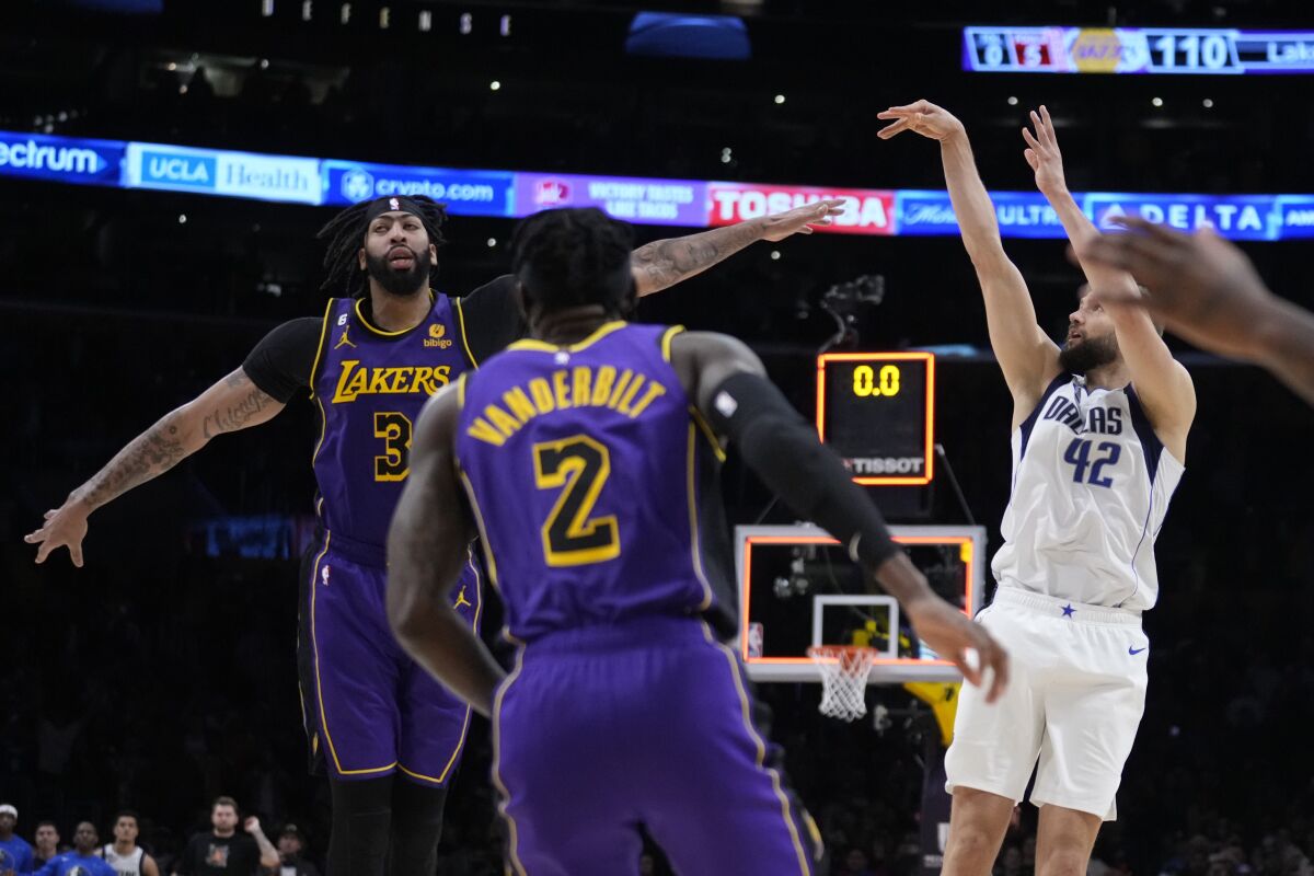Dallas forward Maxi Kleber shoots a game-winning three-pointer over Lakers forward Anthony Davis as time expires.