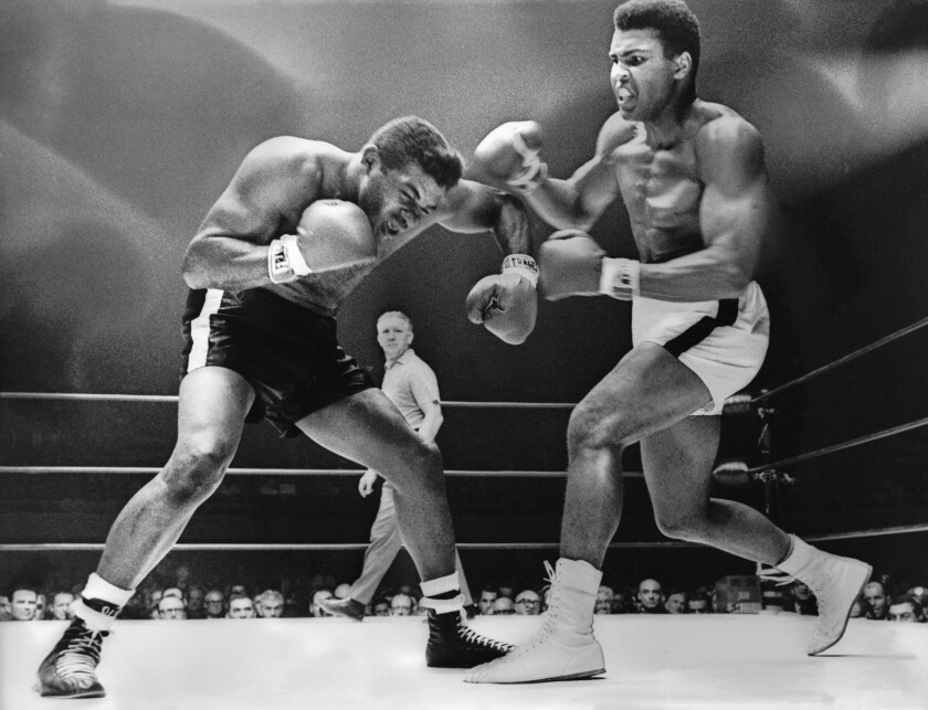 Muhammad Ali, right, fights Floyd Patterson in 1965 in Las Vegas.
