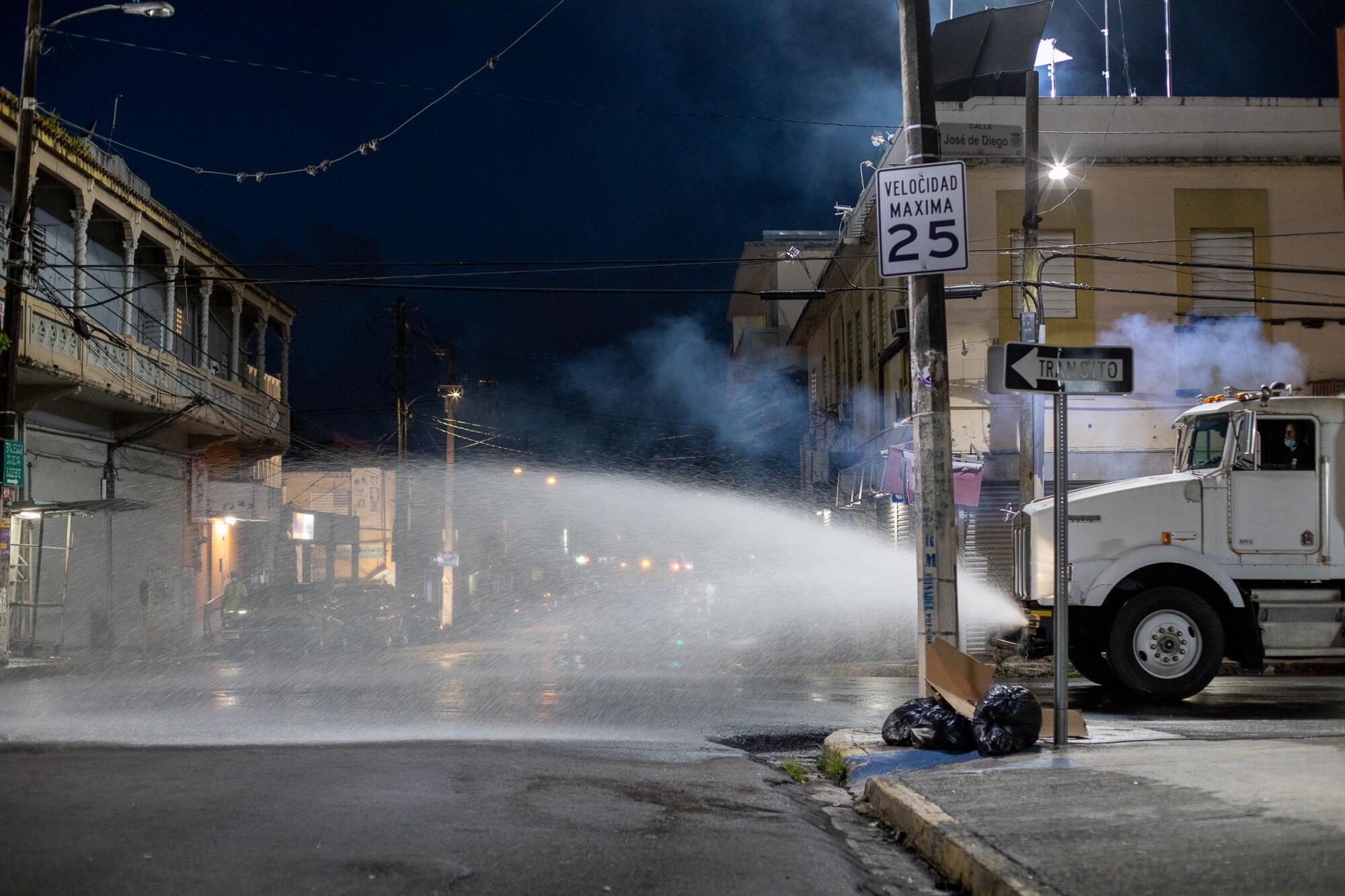 A crew wets down the set of "Simone," directed by Betty Kaplan.