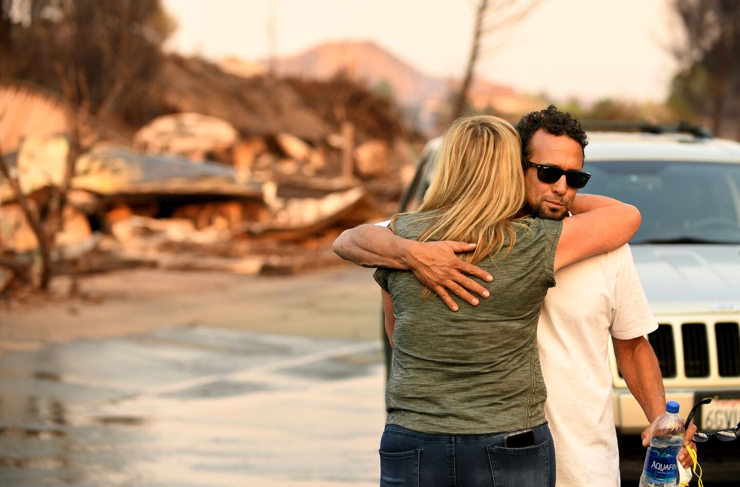 Paullette Koenig hugs neighbor Gai Farbenbloom after both lost their homes at the Seminole Springs mobile home park in Malibou Lake.