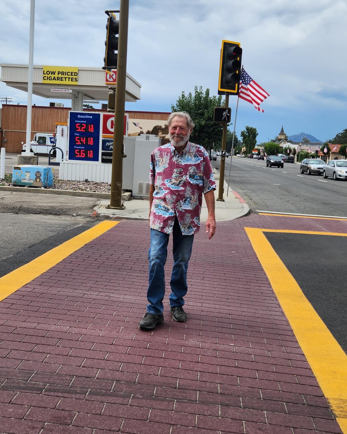 Tom Reese crossing Main and 10th streets on the new brick crosswalk.