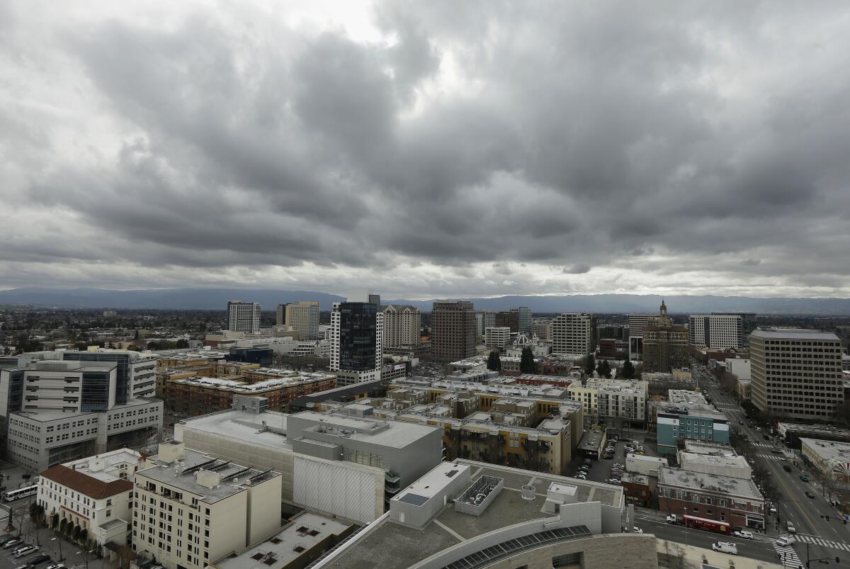 City buildings under a cloudy sky