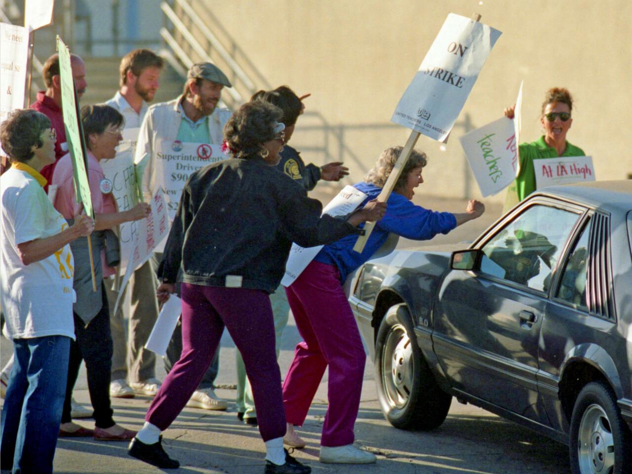 May 23, 1989: Striking teachers challenge car entering parking lot at Los Angeles High School during 1989 LAUSD teachers' strike.