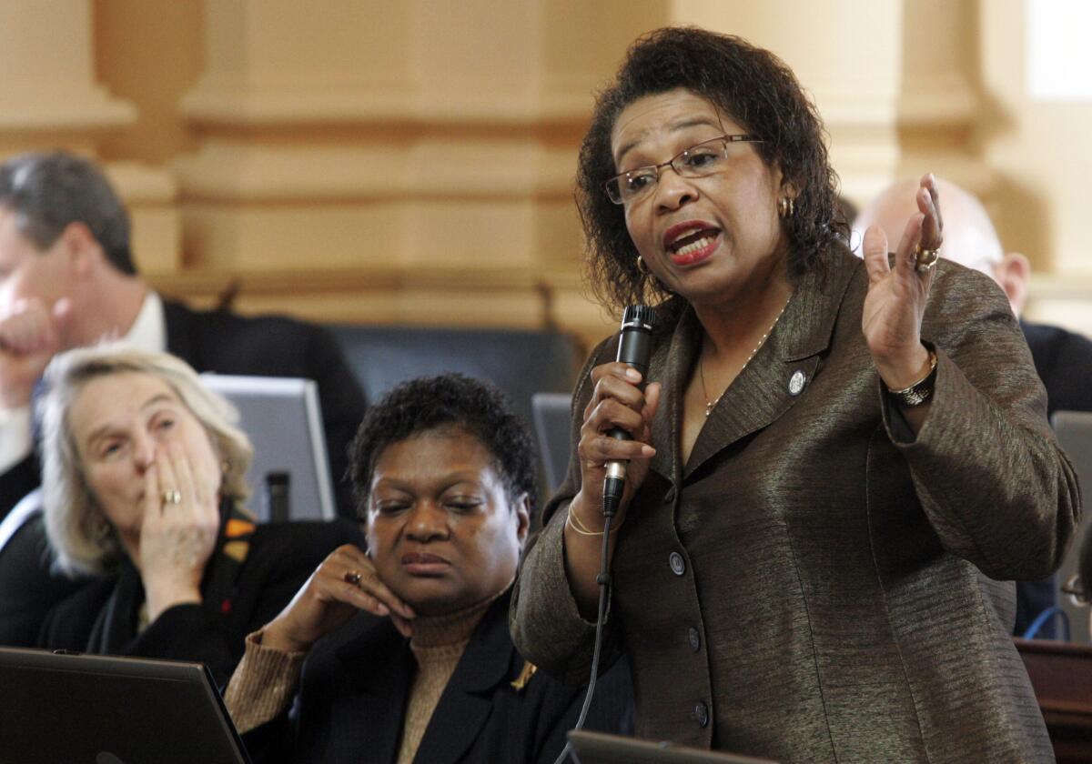 FILE - In this Feb. 25, 2010, file photo, Del. Roslyn Tyler, D-Sussex, right, speaks on the budget as Del. Delores McQuinn, D-Richmond, center, and Del. Betsy Carr, D-Richmond, left, listen during the House session at the Capitol in Richmond, Va. Two of the last remaining rural Democrats in the Virginia House of Delegates, Tyler and Chris Hurst, are being targeted by Republicans hoping to regain the majority they lost to Democrats in both the House and Senate in 2019. Tyler and Hurst reject their opponents' claims and say they've worked hard to improve the lives of the people in their districts. (AP Photo/Steve Helber, File)