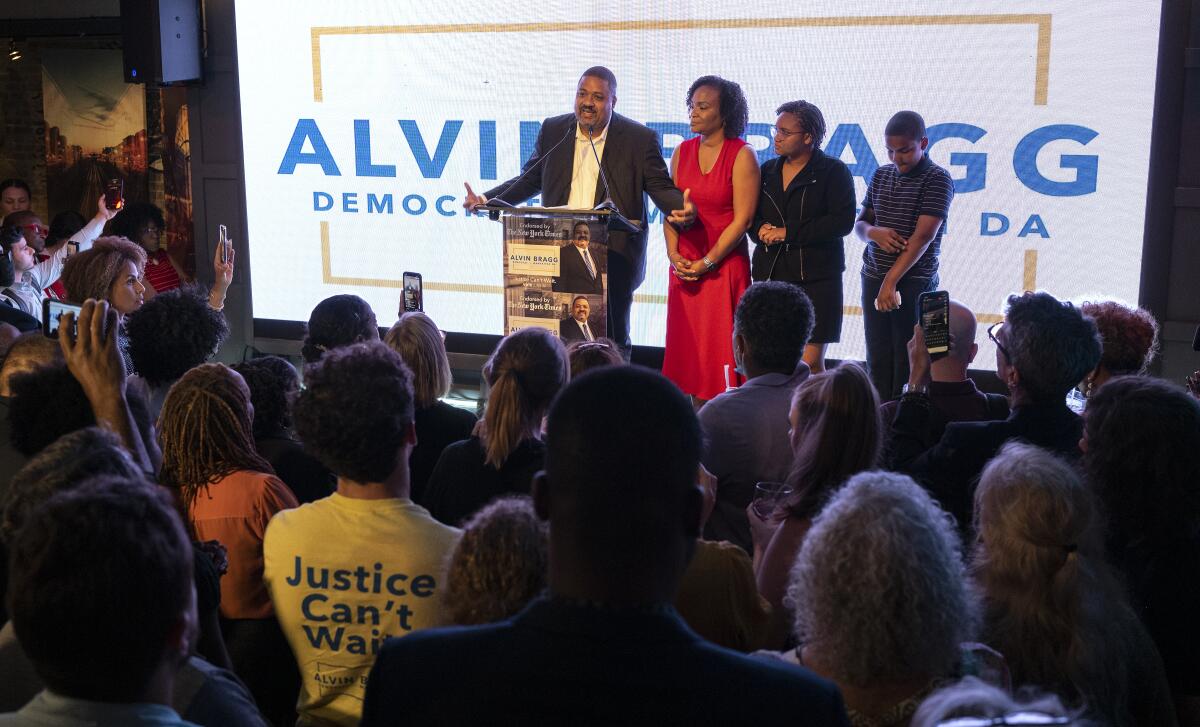 Alvin Bragg, a former top deputy to New York's attorney general, stands with his family as he speaks to supporters in New York, late Tuesday, June 22, 2021. The former top deputy to New York’s attorney general, was poised to become Manhattan’s first Black district attorney and to take over the investigation of former President Donald Trump after his closest opponent conceded in the the Democratic primary.(AP Photo/Craig Ruttle)