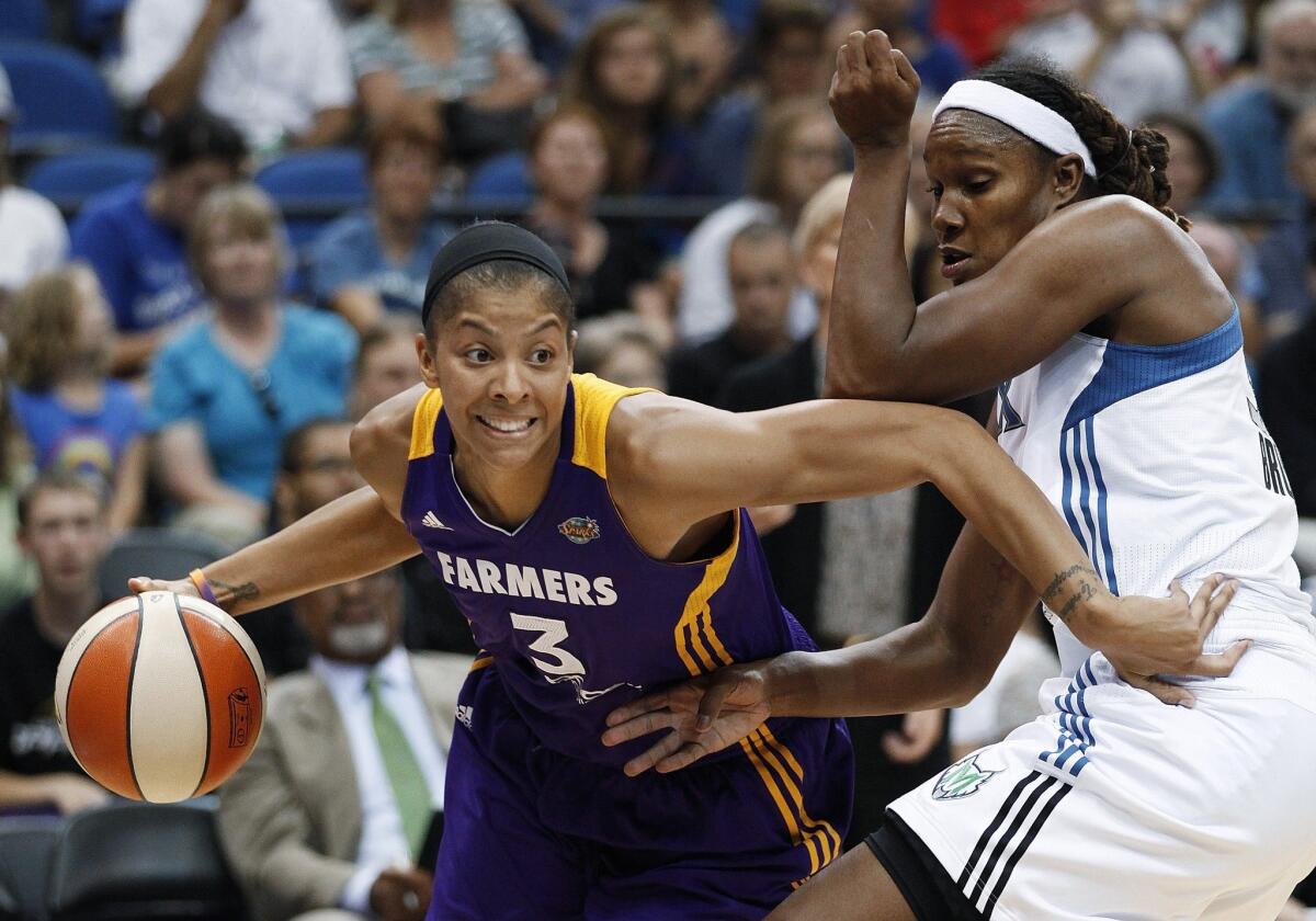 Sparks forward Candace Parker, left, drives around Minnesota's Rebekkah Brunson during a game in 2012.