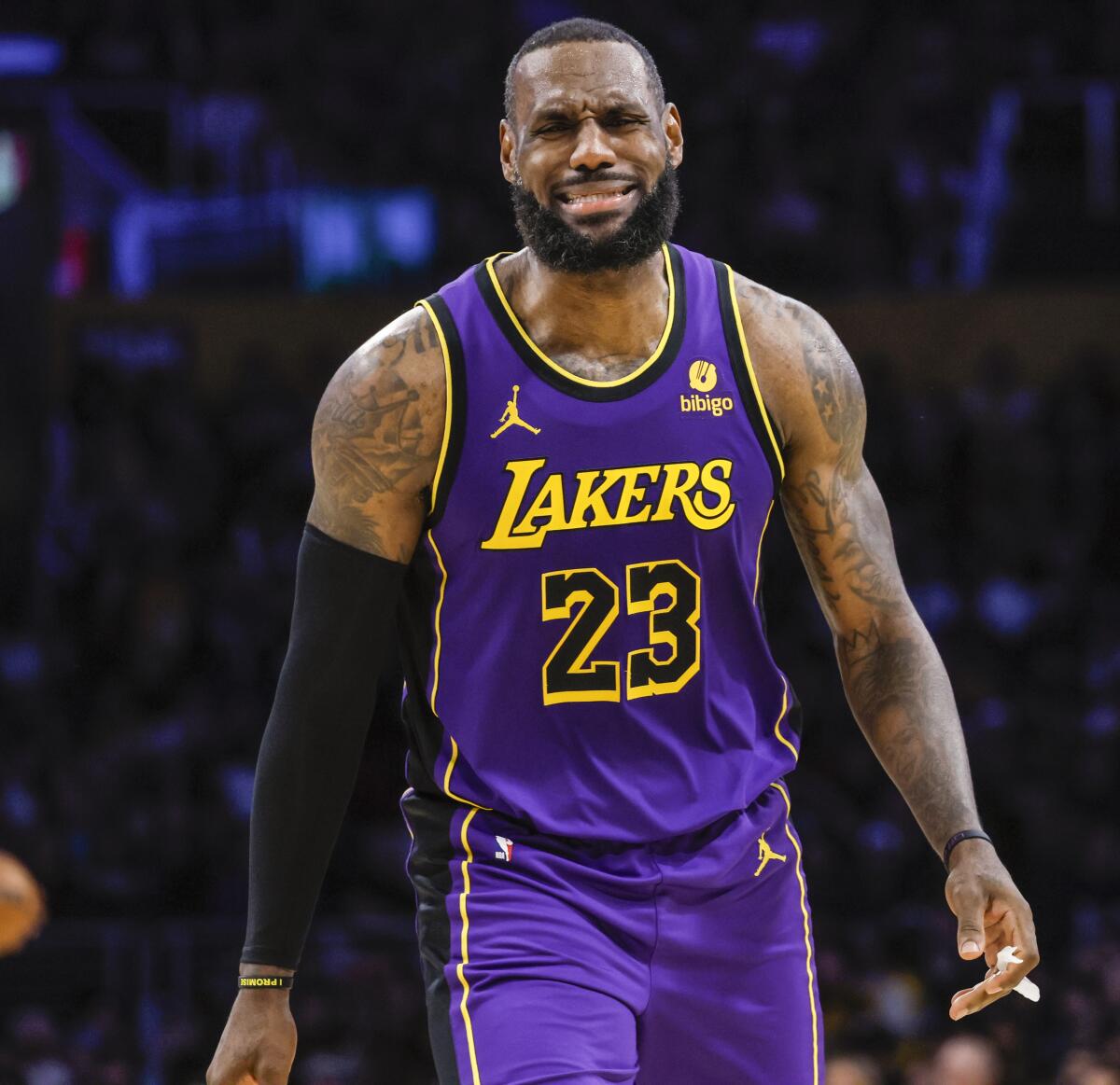 Lakers forward LeBron James expresses his displeasure with a referee's call during Thursday's game against the Suns.