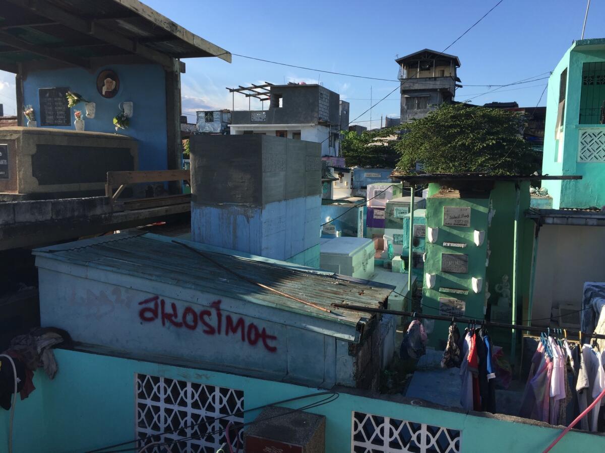 Laundry is hung to dry at the Manila North Cemetery in the Philippines, home to both the living and the dead.