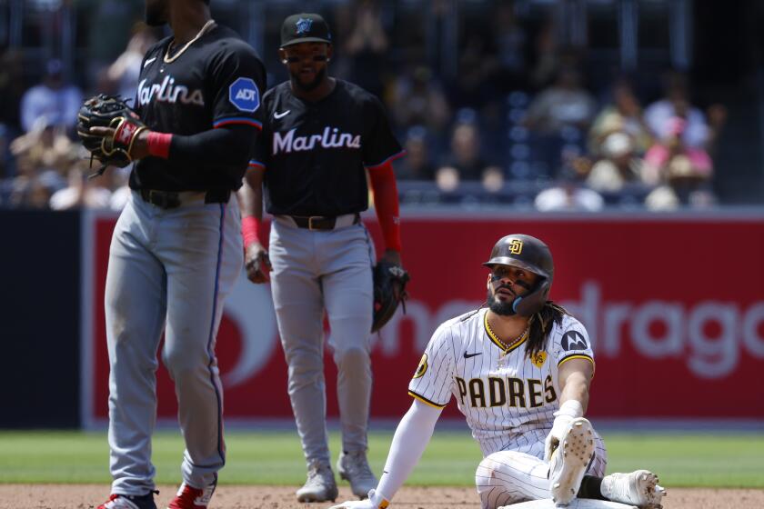 San Diego, CA - May 29: San Diego Padres' Fernando Tatis Jr. sits on second base after getting tagged out after trying to stretch a single into a double against the Miami Marlins at Petco Park on Wednesday, May 29, 2024 in San Diego, CA. (K.C. Alfred / The San Diego Union-Tribune)