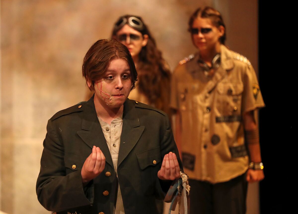 Cast member Cassandra Dow, who plays the king, rehearses a scene from "Antigone" on Tuesday.