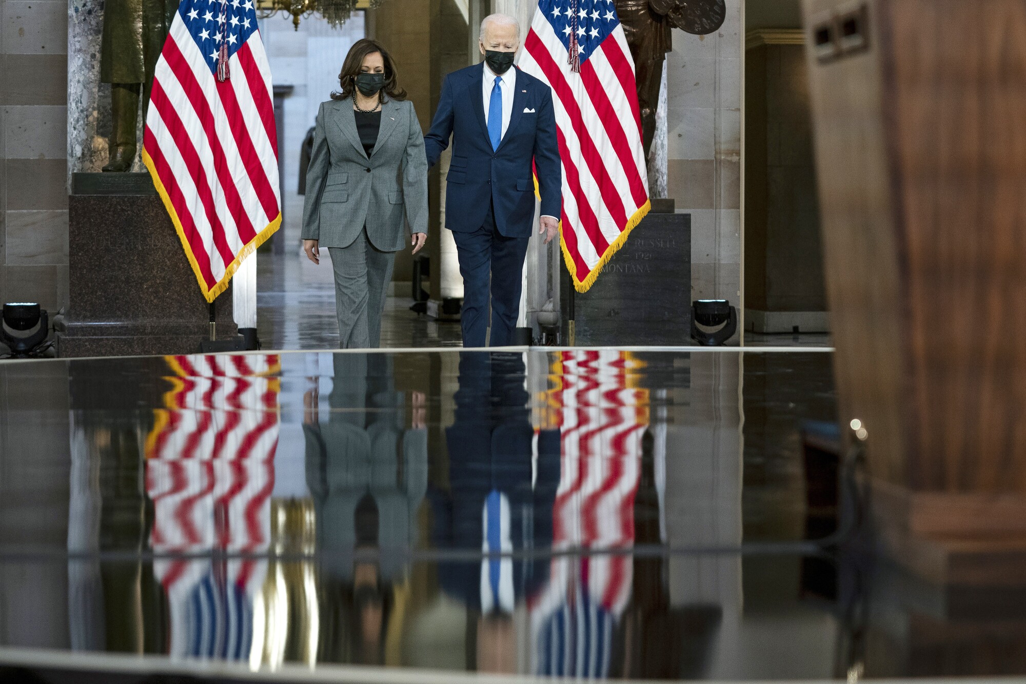 President Biden and Vice President Kamala Harris walk into Statuary Hall at the U.S. Capitol.