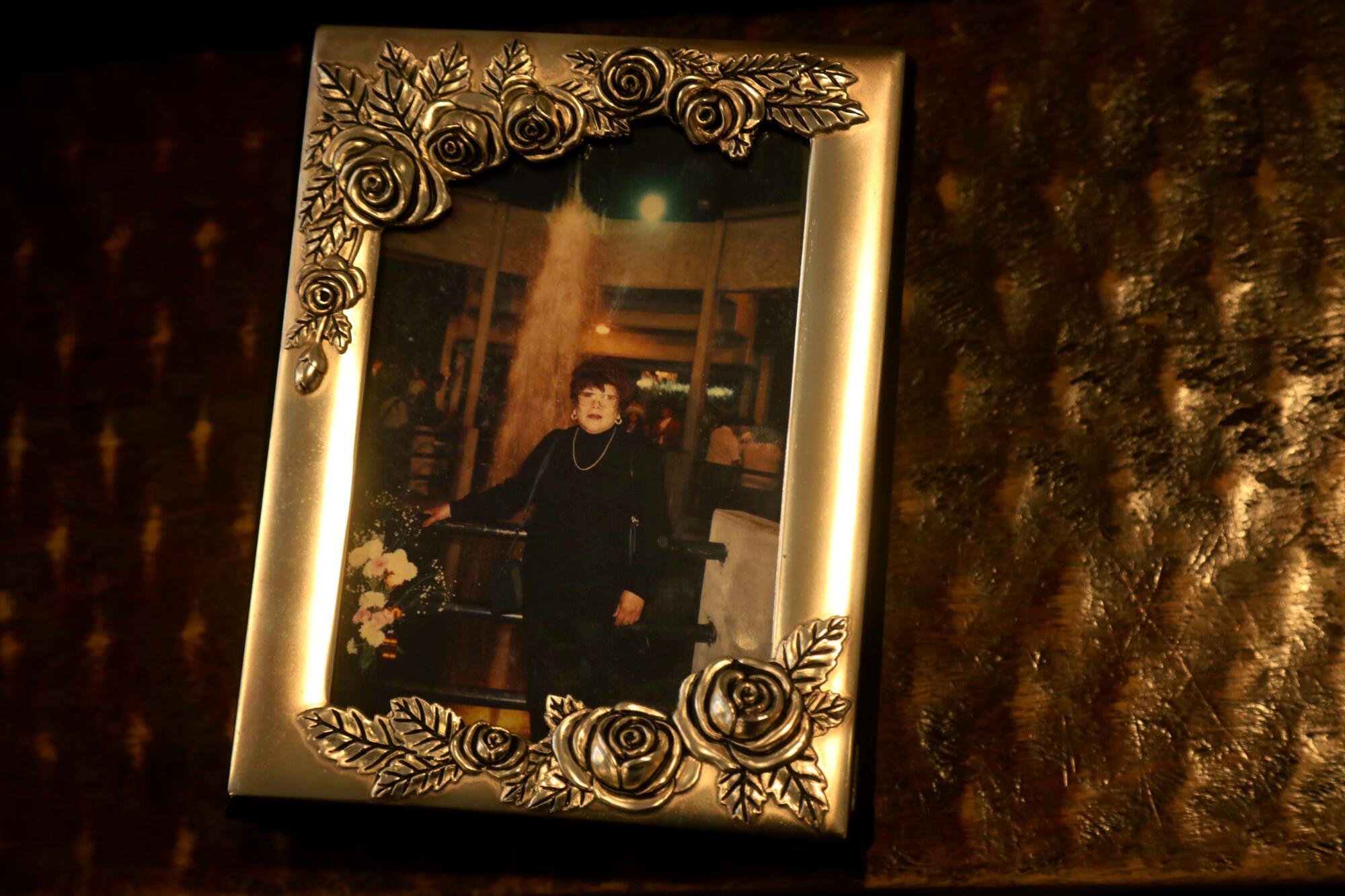 A family album rests on a table in the living room of the Rojas family's apartment.
