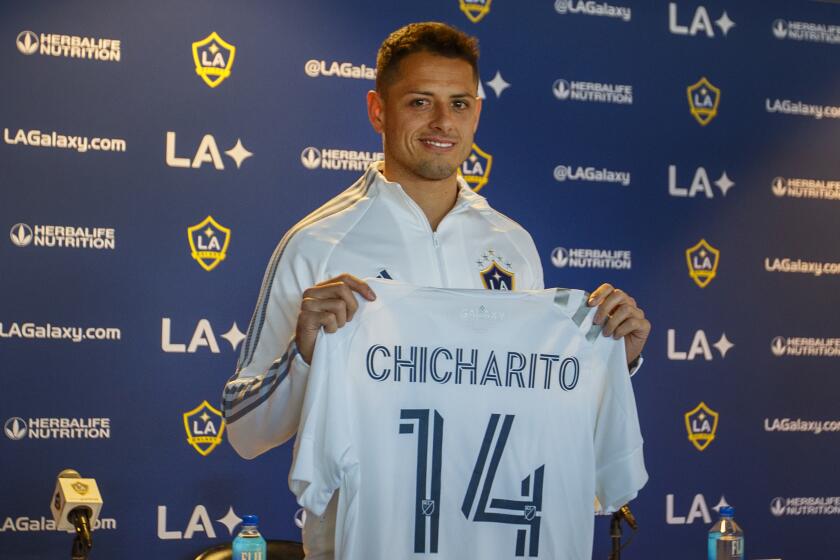 CARSON, CALIF. -- THURSDAY, JANUARY 23, 2020: LA Galaxy’s new player Javier 'Chicharito' Hernandez, the all-time leading Mexican goal scorer, shows off his new jersey during a formal introduction at a news conference at Dignity Health Sports Park in Carson, Calif., on Jan. 23, 2020. (Allen J. Schaben / Los Angeles Times)