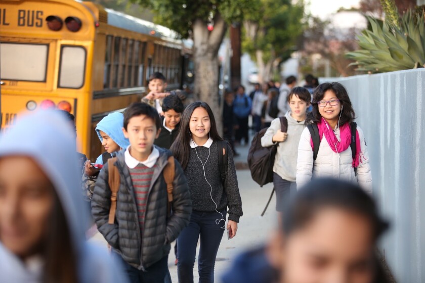 Students like these at Thomas Starr King Middle School in Los Feliz return to school one day after the Los Angeles Unified School District closed more than 900 campuses because of a bomb threat.