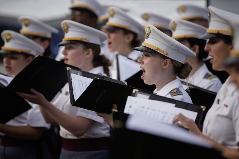 San Diego, California - March 31: Cadets of West Point perform at the Alpha Project shelter in Downtown on Friday, March 31, 2023 in San Diego, California. (Alejandro Tamayo / The San Diego Union-Tribune)