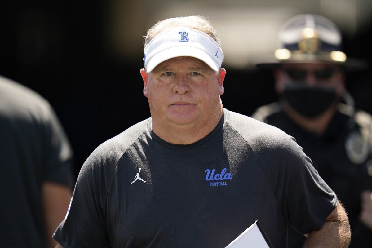 UCLA head coach Chip Kelly walks on to the field before an NCAA college football game against Hawaii Saturday, Aug. 28, 2021, in Pasadena, Calif. (AP Photo/Ashley Landis)